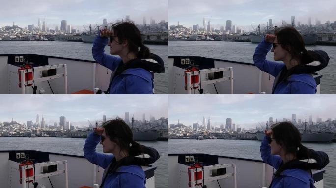 女孩从船上看着旧金山市区