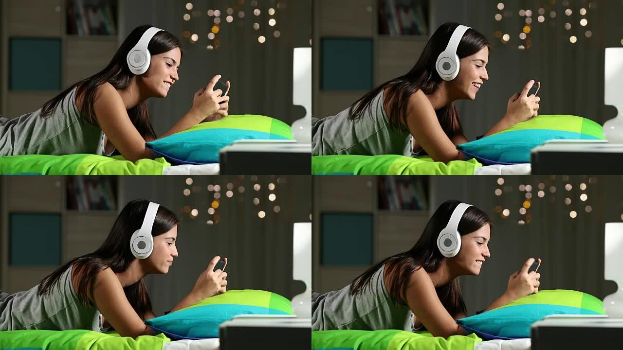 青少年在床上用智能手机玩网络游戏