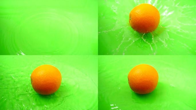 橙色落在水里。慢动作。