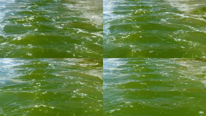 模糊的脏水，在绿色的脏水中移动