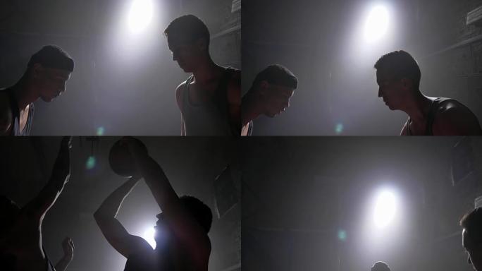 篮球运动员在比赛中阻挡另一名球员的球，带泛光灯的房间