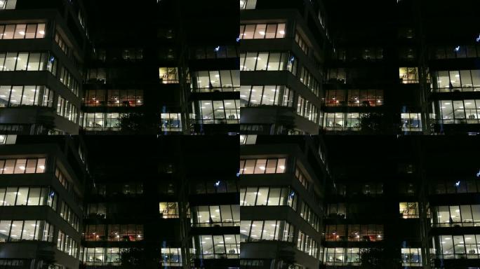 办公大楼和深夜工作的工人