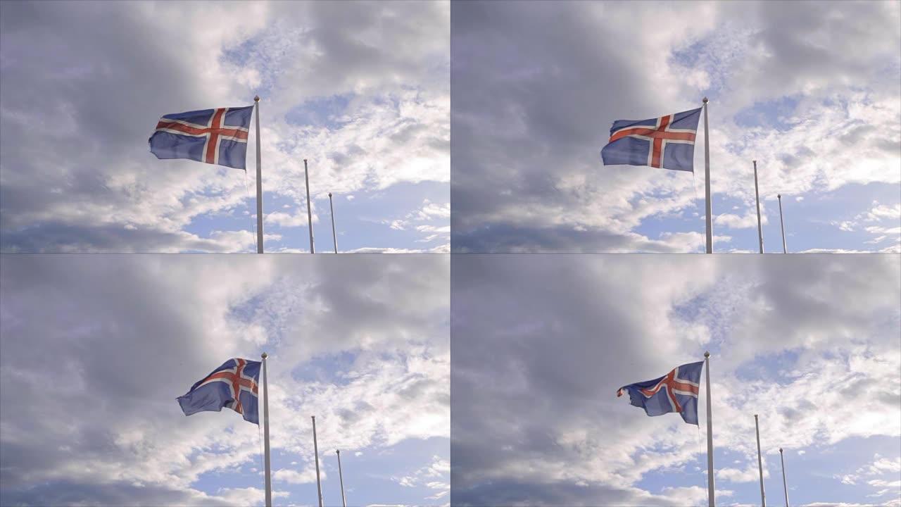 在日落时，冰岛国旗在天空和太阳下飘扬-慢动作视频-旅游目的地北欧国家的概念