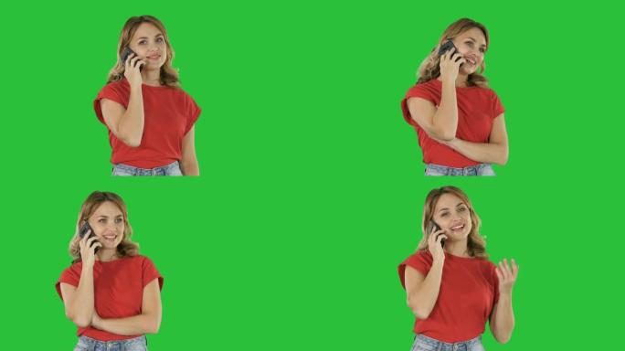 穿着红色t恤的年轻美女在绿屏上在手机上讲话，色键