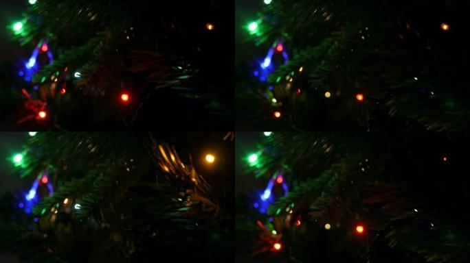 人造树上的圣诞仙女灯序列4K 2160p 30fps超高清镜头-新年夜闪烁装饰灯泡特写3840x21