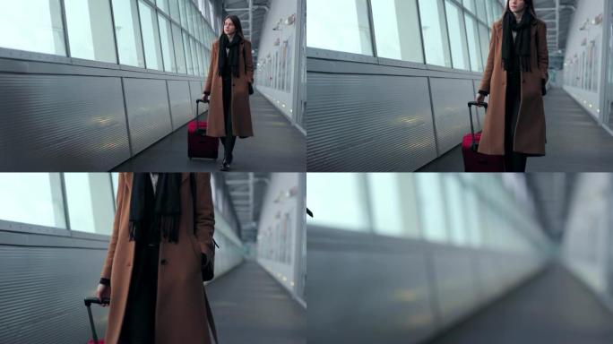 机场上的女商人在带手提行李在火车站或机场前往登机口时，在智能手机上聊天。女孩用手机交谈。