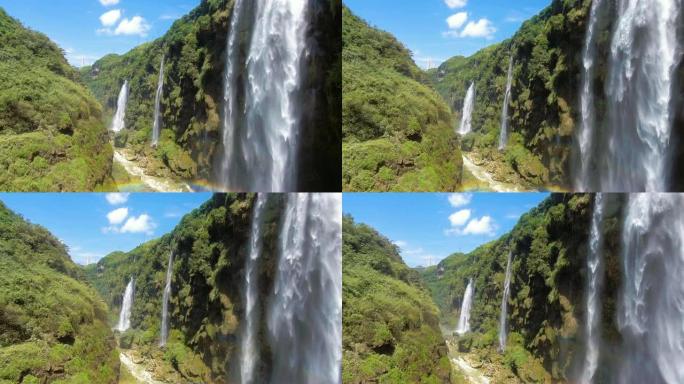 中国贵州省马岭河峡谷悬崖峭壁上风景瀑布的鸟瞰图