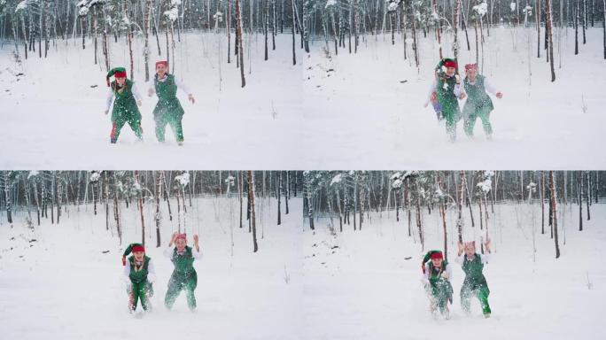 两个戴着帽子的绿色西装的精灵在冬季森林的背景上玩耍和扔雪。