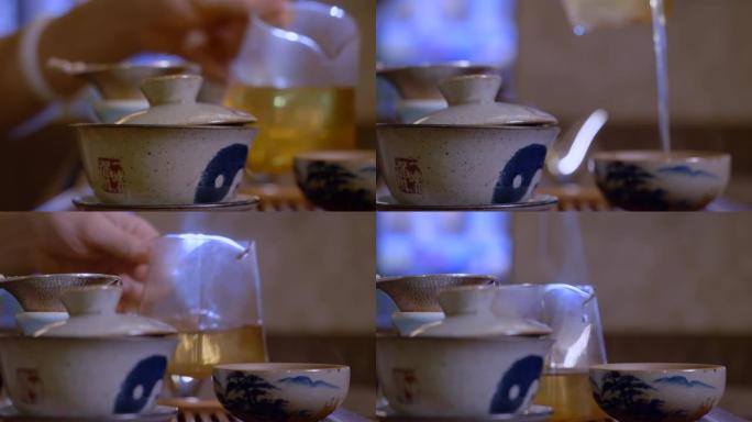 大师将公平碗中的茶水倒入杯中。中国茶道