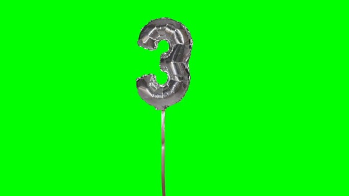 三岁生日周年纪念银气球漂浮在绿色屏幕上