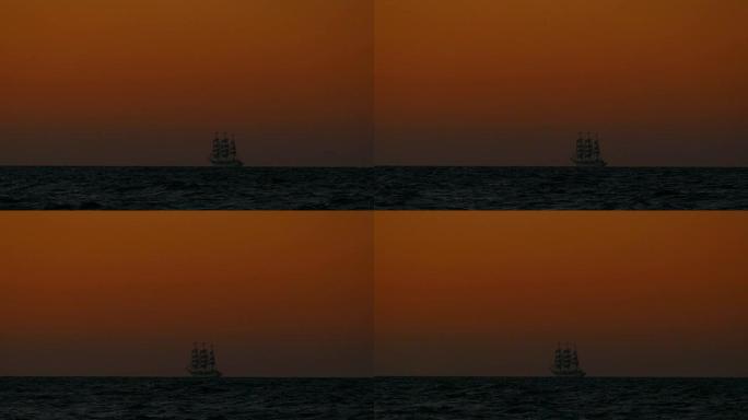 旅行背景-日落时航行中的老式高船