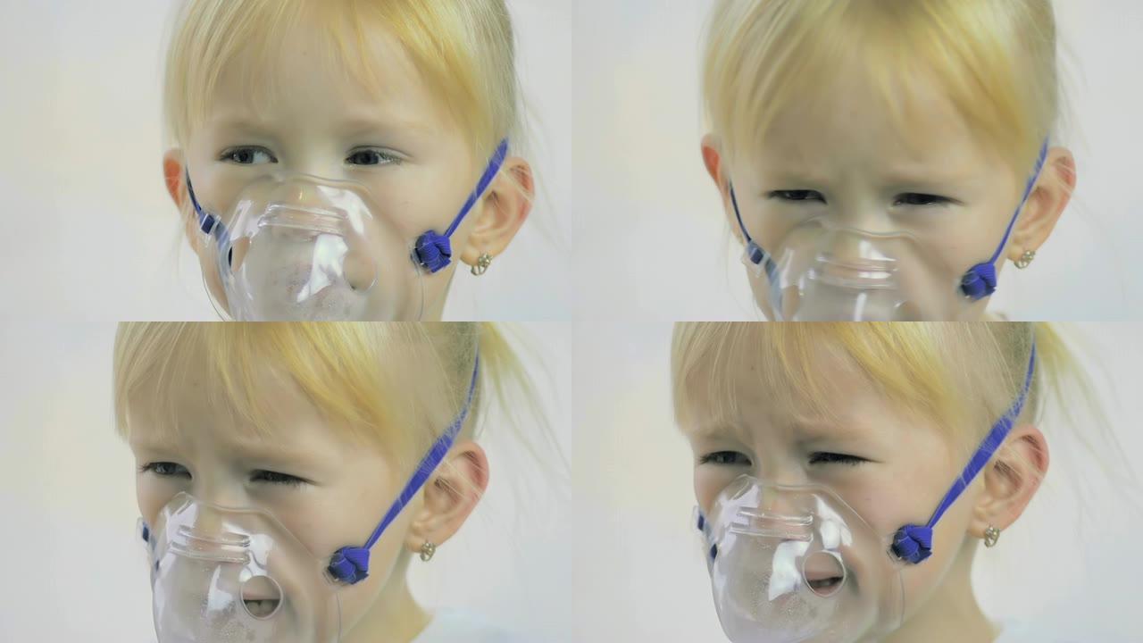 一个四岁女孩在医院通过吸入器面罩做呼吸程序的特写镜头。