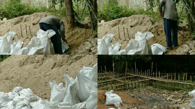 老人用沙子填充袋子以建造检查大坝