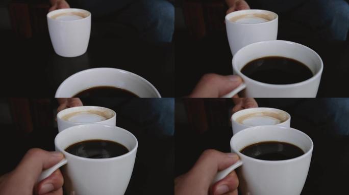 两个人在咖啡馆里碰碰白色咖啡杯的特写照片