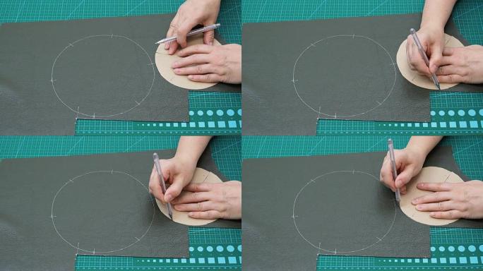 工匠使用纸形绘制小袋的切割图案