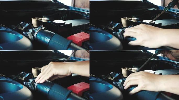 技术人员检查和修理汽车的手。复古色调。