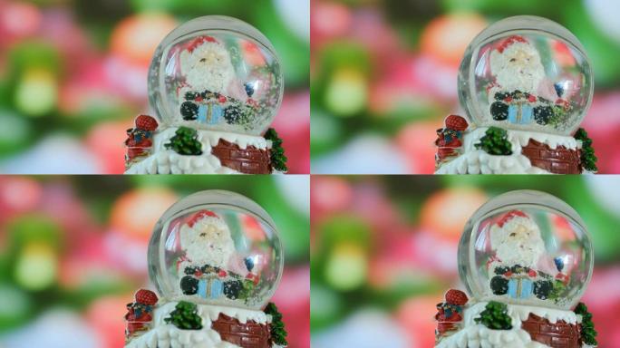 4K: 水晶球中的圣诞老人和雪花，圣诞节概念。