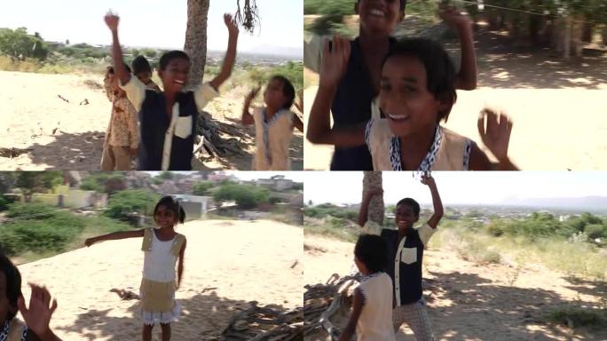 印度儿童在印度拉贾斯坦邦的沙地地区描绘快乐和兴奋，玩耍和快乐