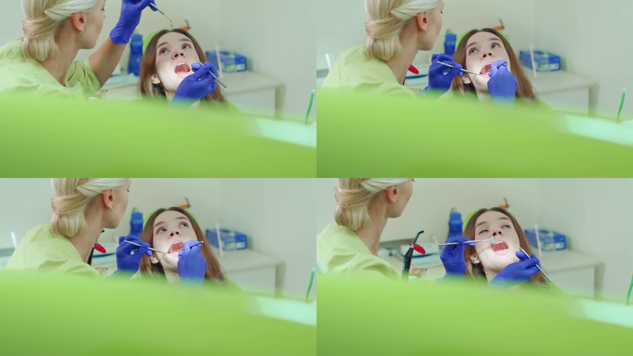 有定期牙科检查的女孩。年轻女子看牙医