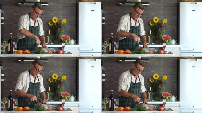 戴眼镜的成熟男人在厨房准备沙拉。在碗里搅拌蔬菜。退休时在厨房里表情严肃，调味沙拉