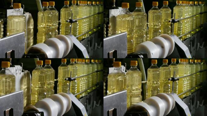 一个带有向日葵油的塑料瓶子在传送带上移动