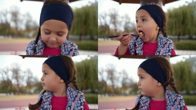 可爱的小女孩享受水果沙拉