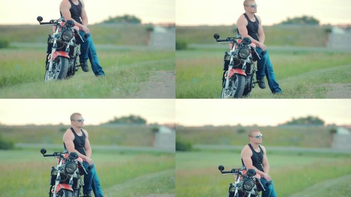 戴着墨镜的骑自行车的人坐在高速公路附近的摩托车上。从下至上拍摄的相机