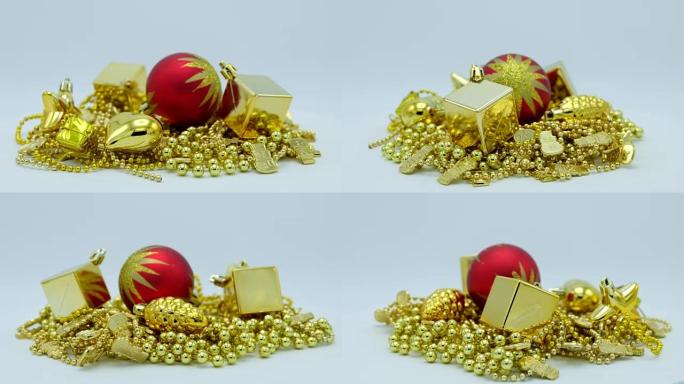 金色圣诞装饰和红色球，白色背景上有星星旋转。