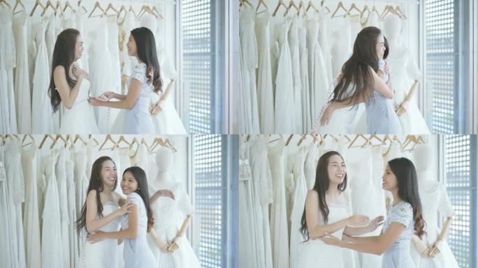 迷人的新娘在商店里选择婚纱，年轻漂亮的新娘穿着蓬松的礼服在工作室里摆姿势