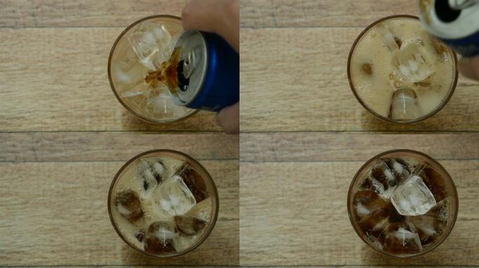 用手将可乐倒在玻璃上的冰块上