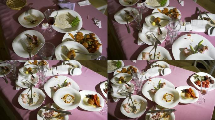 盛宴后，桌上摆着脏盘子。