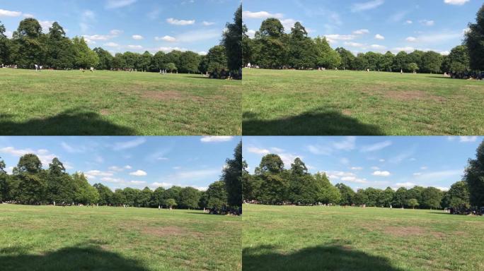 在伦敦格林威治公园享受夏天的人群的时间流逝