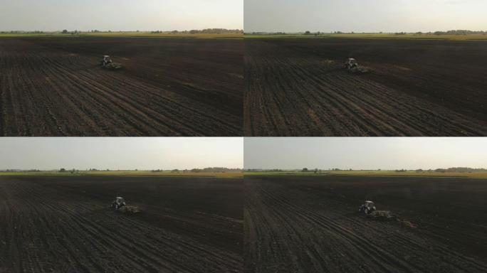 无人机拍摄到一名农民在大豆田喷洒农药