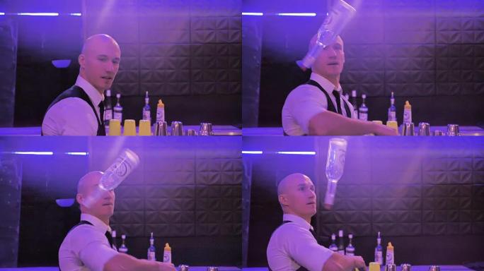 调酒师玩杂耍的瓶子，这名男子正在慢动作中展示令人印象深刻的表演