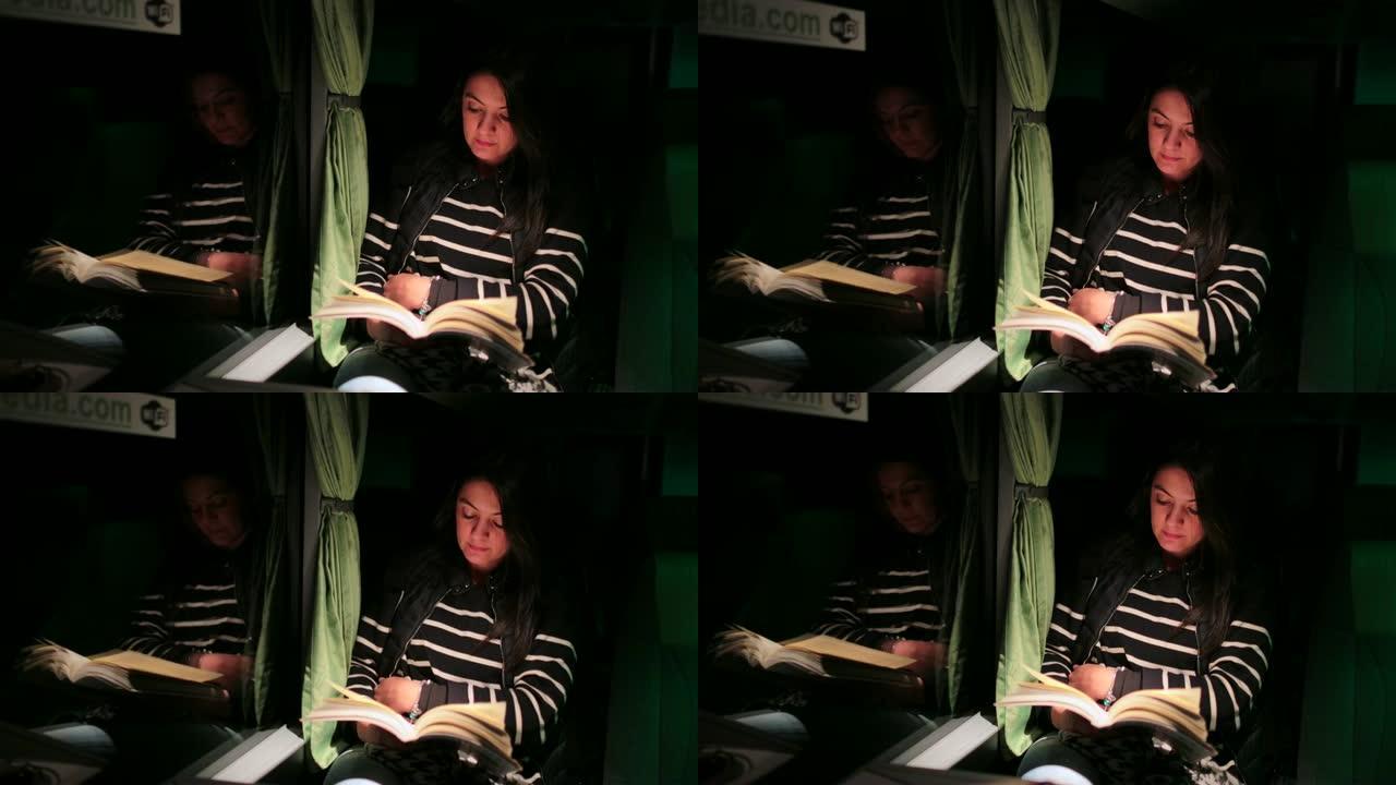 年轻女子在4k乘公共汽车旅行时看书