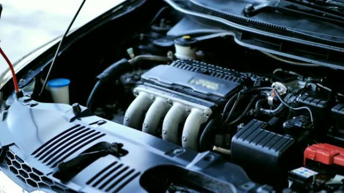 清洗后，男人用空气给发动机。清洁洗车概念。慢动作