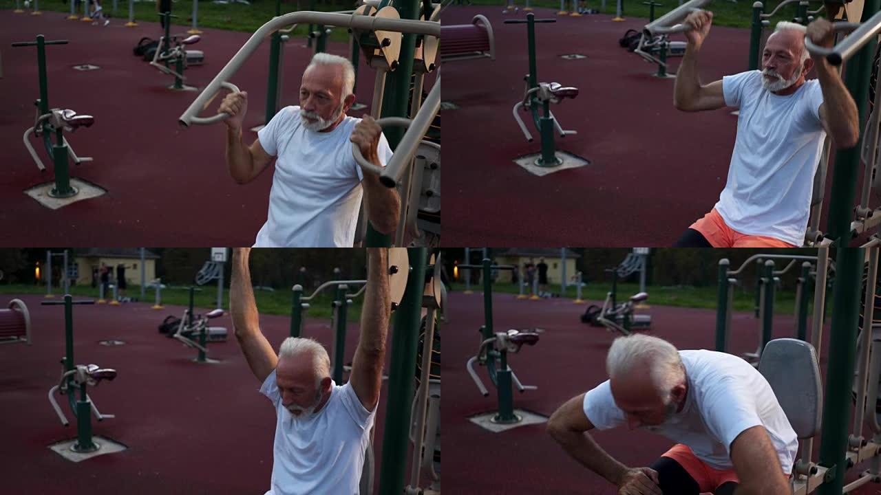 退休的老年人在户外拉动机器上锻炼