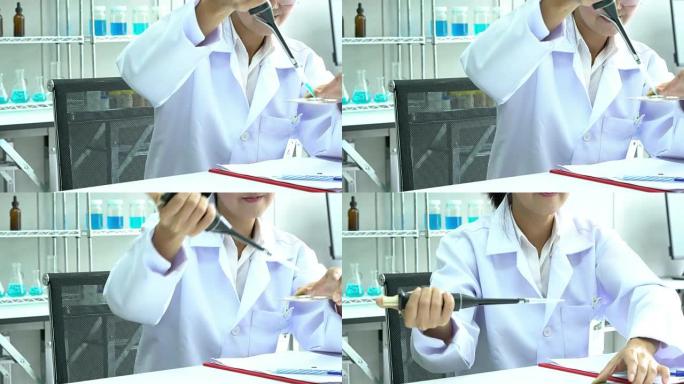 科学家正在试验化学物质的化合物和吸收液体的试管。科学、测试开发和实验室行业的概念。