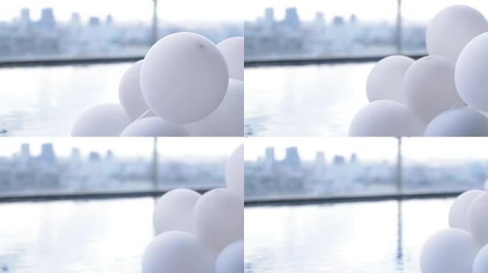 泳池移动通行证摄像机中的白色气球装饰