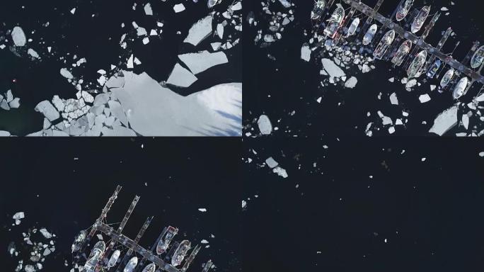 传统渔船在寒冷的晴天躺在浮冰的港口，挪威，斯堪的纳维亚半岛