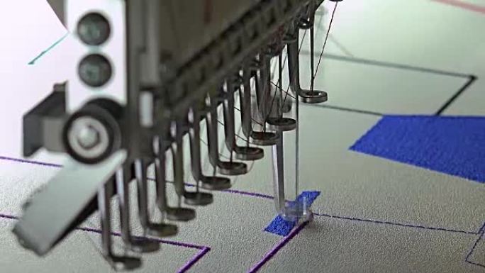 自动现代缝纫机刺绣图案，工业刺绣设备。纺织制造商。工业纺织厂、纺织厂。纺织业。