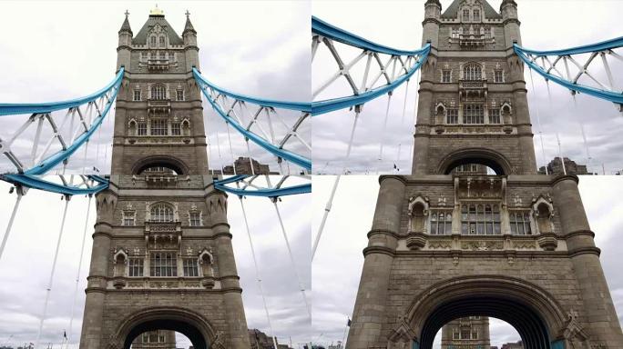 在英国伦敦标志性的塔桥下拍摄的低角度无人机视图