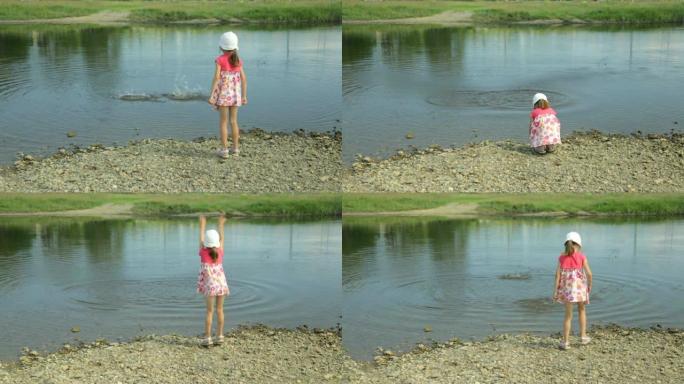 小女孩把石头扔进水里