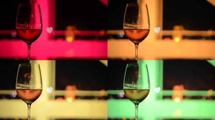 玻璃中的桃红葡萄酒的高清镜头，带有爱情形状的bokeh光线和屋顶建筑的颜色变化。