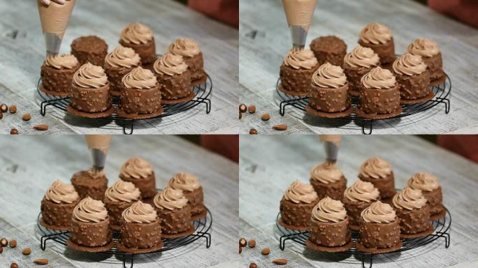 装饰巧克力迷你慕斯蛋糕。巧克力榛子慕斯蛋糕覆盖巧克力釉。