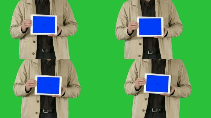 男性手握平板电脑，绿屏蓝屏样机，色度键