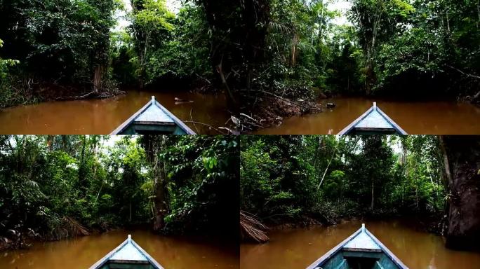 独木舟穿越洪水泛滥的丛林，前往偏远的原住民社区
