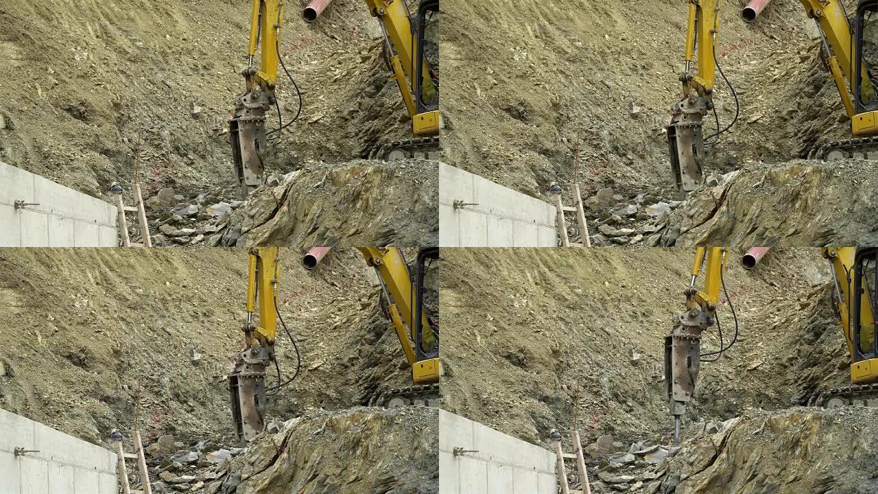 挖掘机上的大型气动锤在建筑工地的采石场中砸碎岩石。