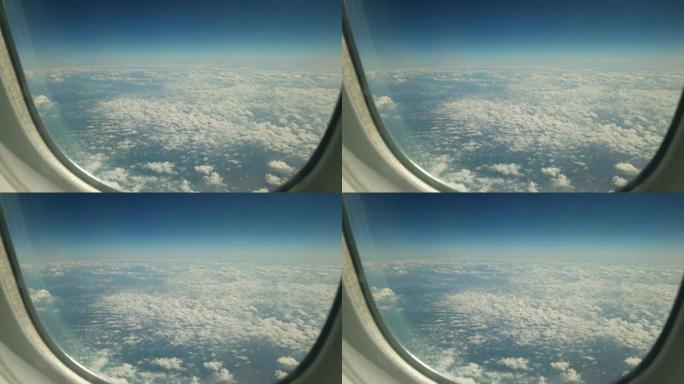 从飞机窗口向外看，看到下面的中音积云