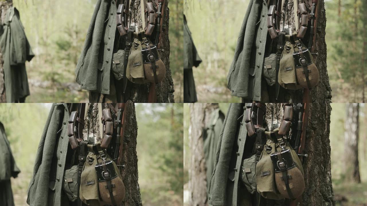 第二次世界大战中德国国防军步兵的军事装备。步枪，烧瓶和袋罐，用于防挂在树干上的气体